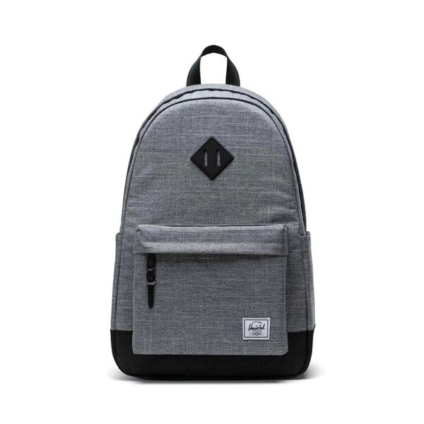 Heather grey backpack with black leather accents on center and bottom, with Herschel logo patch on small zipper pocket.